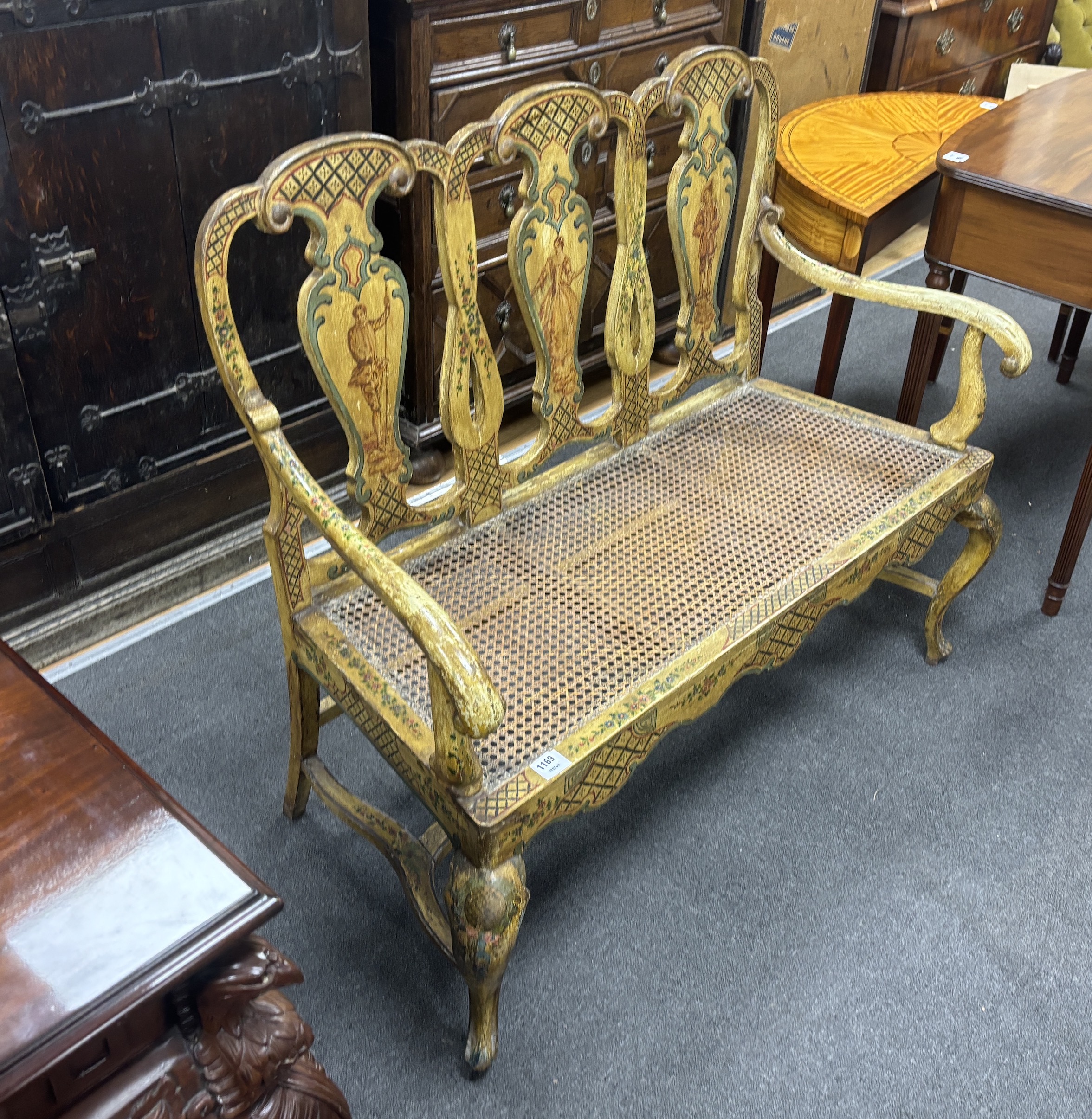 An 18th century style Italian painted and caned seat chair back settee, width 123cm, depth 49cm, height 106cm